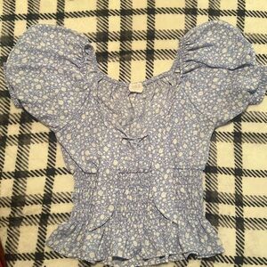 Blue and white floral off the shoulder puff sleeve.